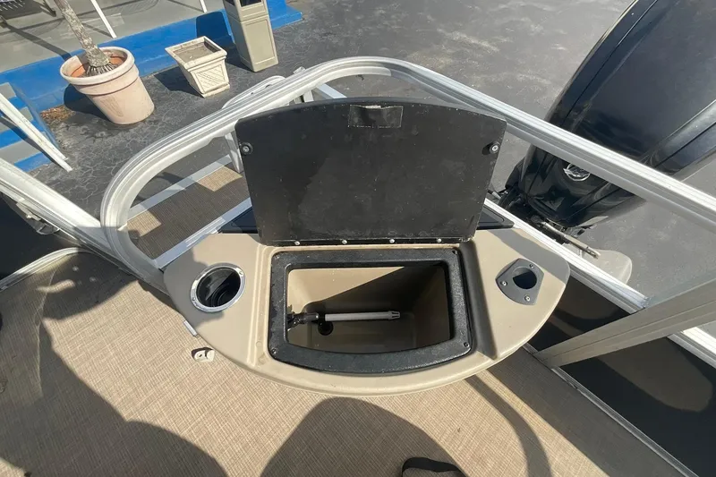 Slide: The Image of Open storage compartment on 2021 Sun Tracker Fishin' Barge 20 DLX pontoon boat. - 13