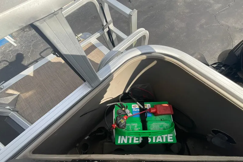 Slide: The Image of Battery compartment of a 2021 Sun Tracker Fishin' Barge 20 DLX pontoon boat. - 14