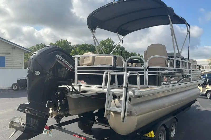 Slide: The Image of 2021 Sun Tracker Fishin' Barge 20 DLX pontoon boat with Mercury outboard motor. - 3