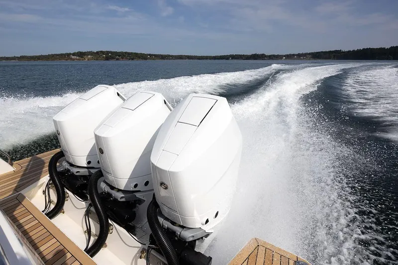 Slide: The Image of Manufacturer Provided Image: 2026 Back Cove 39O boat with triple outboard engines cruising on open water. - 3