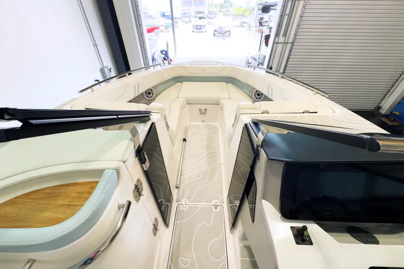 Slide: The Image of 2024 Regal LX9 boat interior with sleek seating and modern dashboard design. - 11