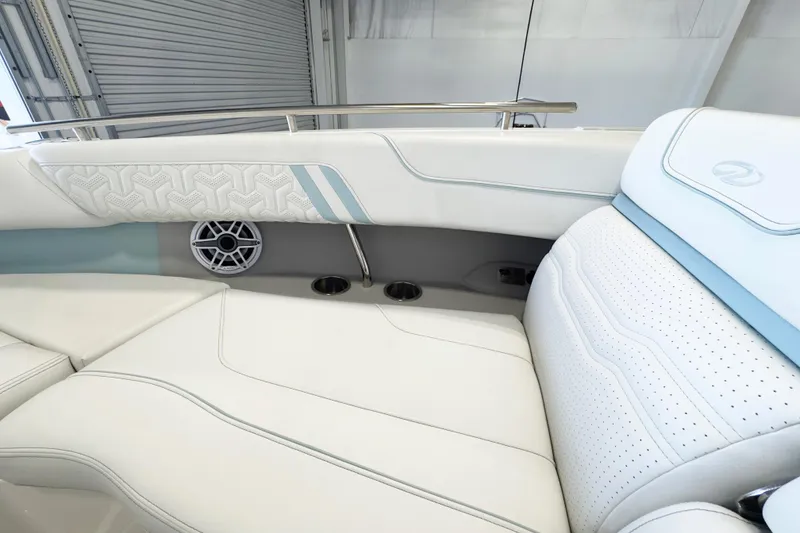 Slide: The Image of Luxurious interior of 2024 Regal LX9 boat with elegant white seating and speaker system. - 12
