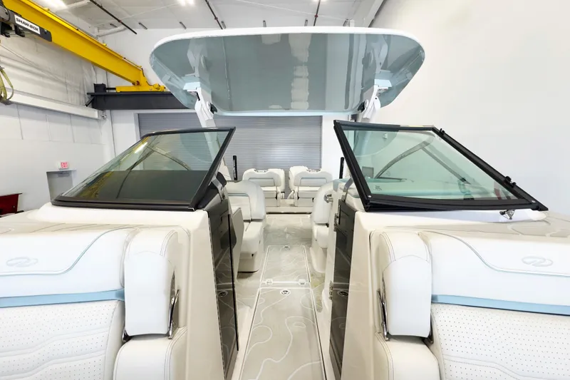 Slide: The Image of 2024 Regal LX9 boat interior with sleek design and modern seating arrangement. - 4