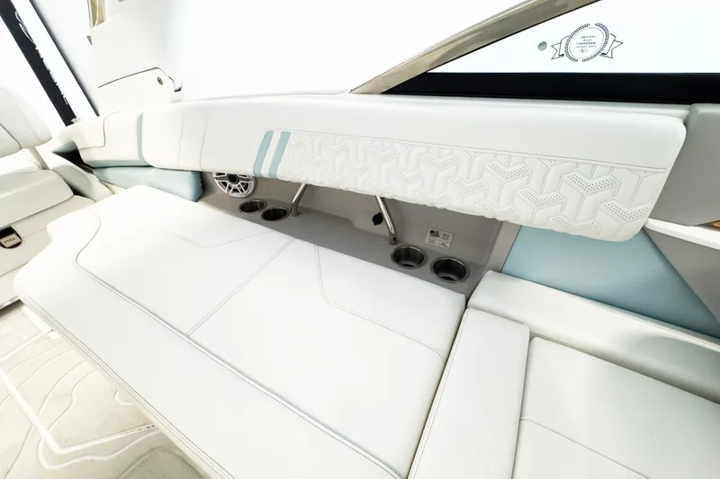 Slide: The Image of Luxurious interior of 2024 Regal LX9 boat with white seating and modern design elements. - 6