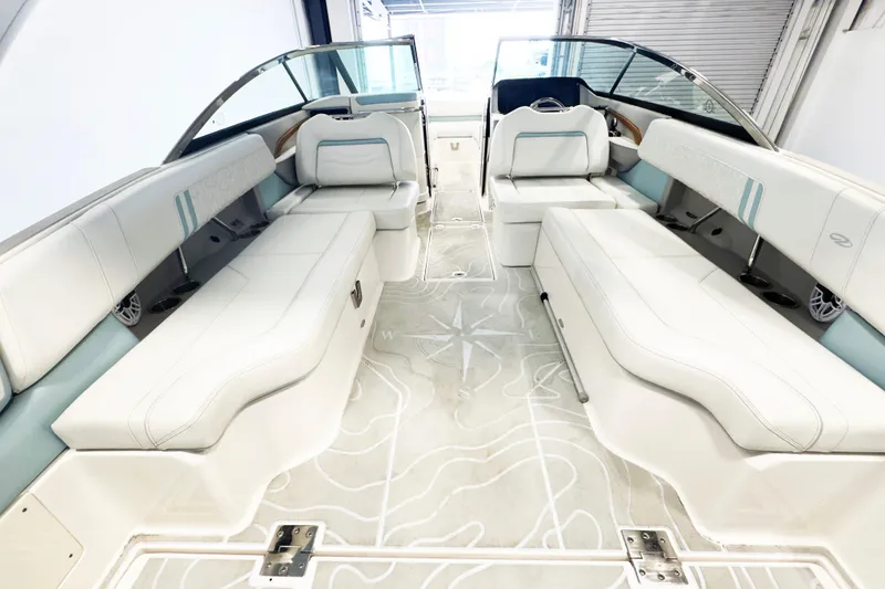 Slide: The Image of 2024 Regal LX9 boat interior with luxurious white seating and modern design. - 7