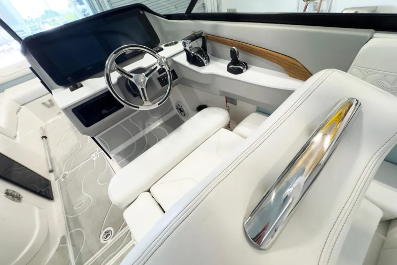 Slide: The Image of Luxurious 2024 Regal LX9 boat interior with sleek steering and modern dashboard design. - 8