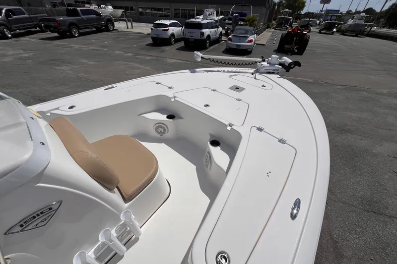 Slide: The Image of 2016 Tidewater 1910 Bay Max boat with tan seating, parked in a lot. - 10