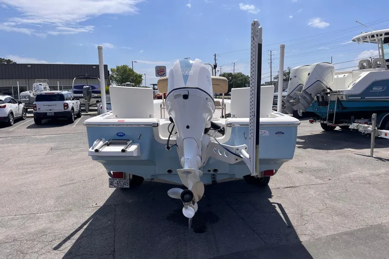 Slide: The Image of 2016 Tidewater 1910 Bay Max boat with outboard motor in a dealership lot. - 4
