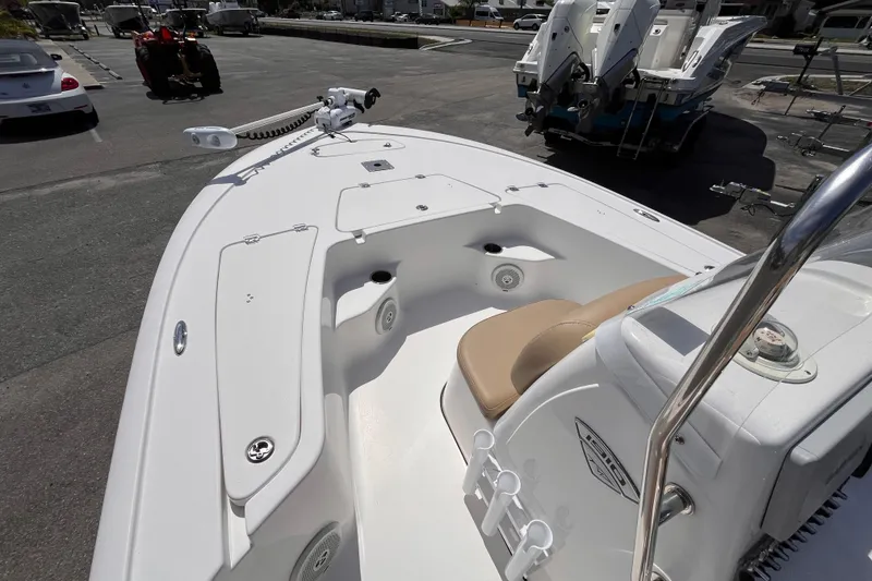Slide: The Image of 2016 Tidewater 1910 Bay Max boat interior with seating and storage compartments. - 8