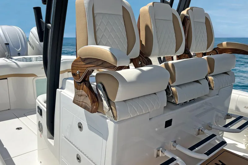 Slide: The Image of Luxury seating on 2027 Regulator 35 boat, featuring elegant design and ocean backdrop. - 12