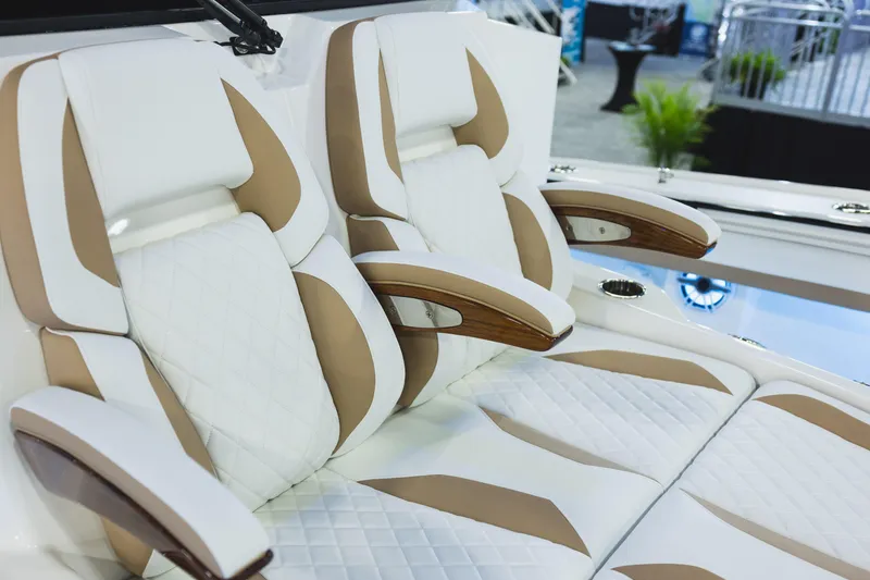 Slide: The Image of Luxurious seating on 2027 Regulator 35 boat, featuring white and tan upholstery. - 15