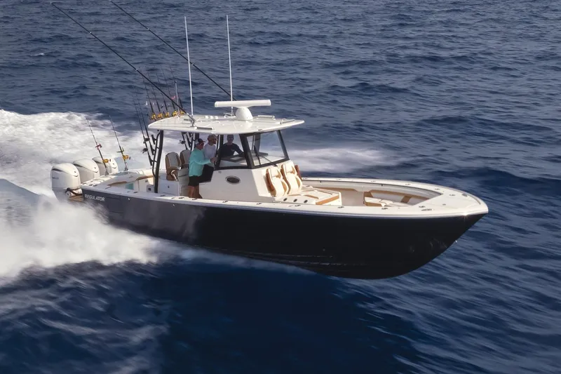 Slide: The Image of 2027 Regulator 35 boat cruising swiftly on open ocean waters. - 9