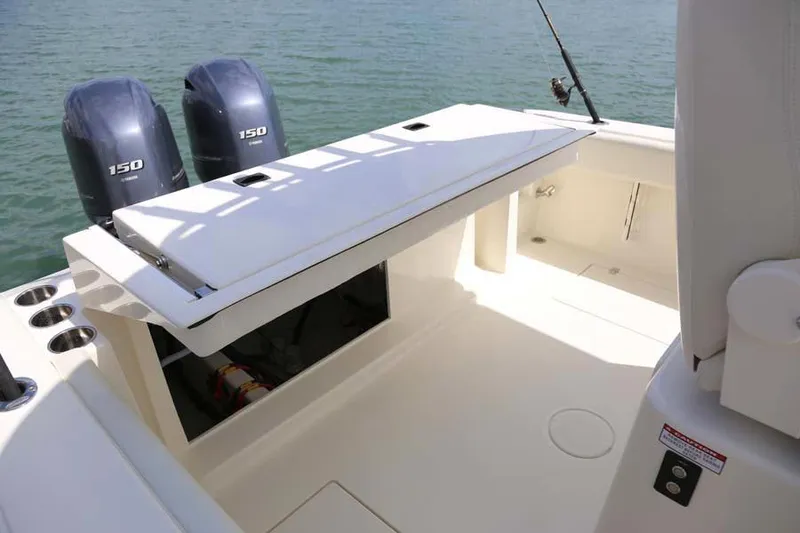 Slide: The Image of Manufacturer Provided Image: 2022 Cobia 262 Center Console boat with twin 150 HP engines on water. - 10