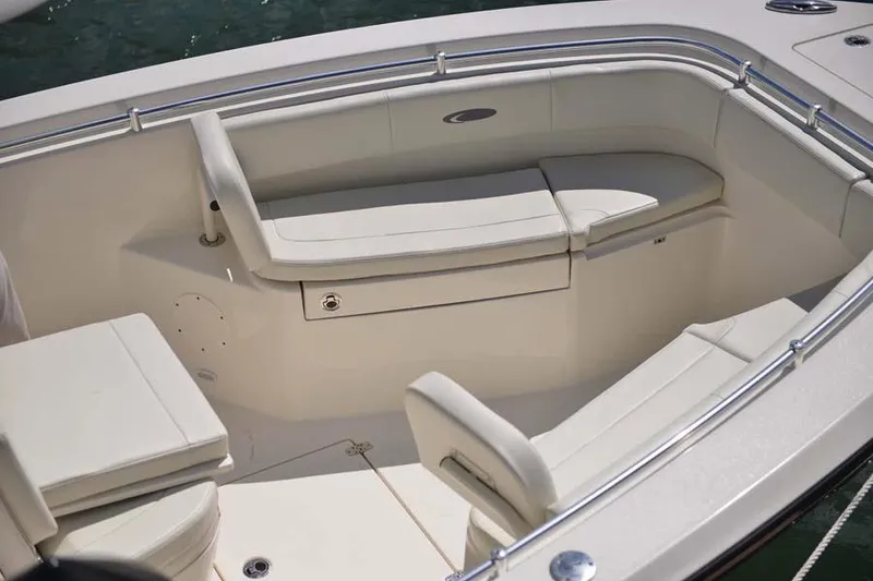 Slide: The Image of Manufacturer Provided Image: 2022 Cobia 262 Center Console boat with spacious seating area. - 5
