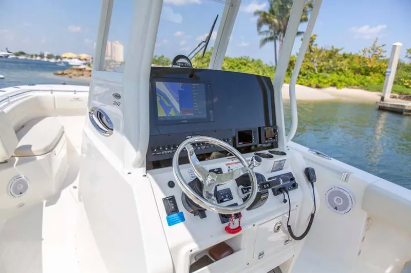 Slide: The Image of Manufacturer Provided Image: 2022 Cobia 262 Center Console boat dashboard with navigation system and controls. - 7
