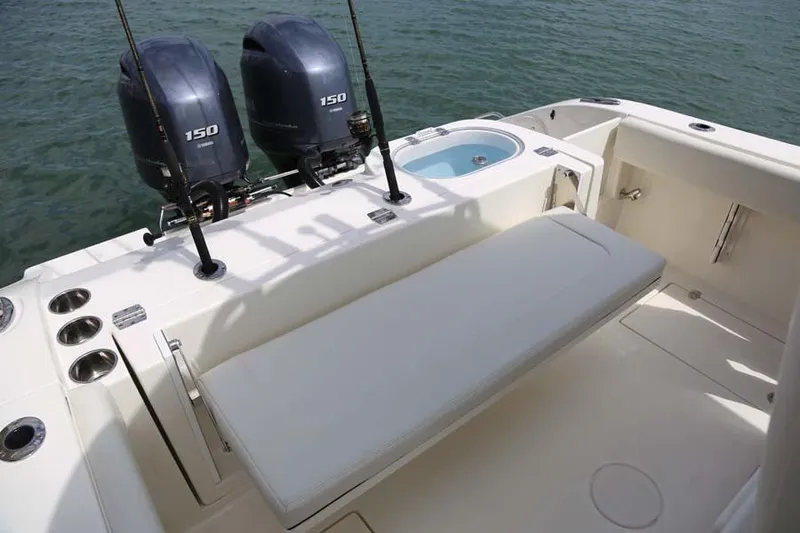 Slide: The Image of Manufacturer Provided Image: 2022 Cobia 262 Center Console boat with twin 150 HP engines and spacious seating. - 9