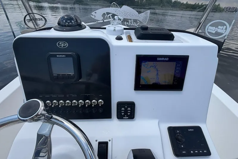 Slide: The Image of 2023 Sea Pro 228 Bay boat dashboard with navigation and control systems. - 7