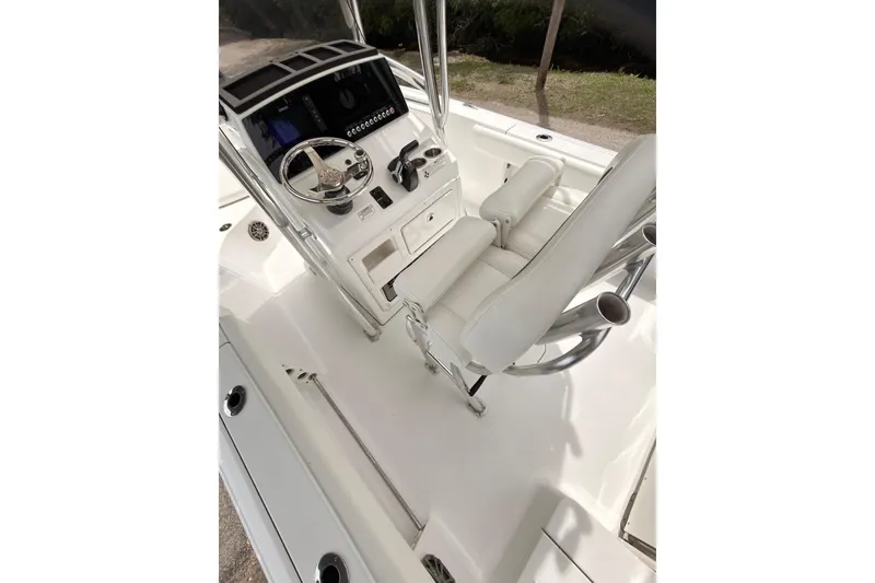 Slide: The Image of 2015 Sportsman Open 212 Center Console boat interior with steering wheel and seating. - 11