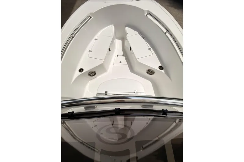 Slide: The Image of 2015 Sportsman Open 212 Center Console boat interior, featuring spacious seating and storage compartments. - 16