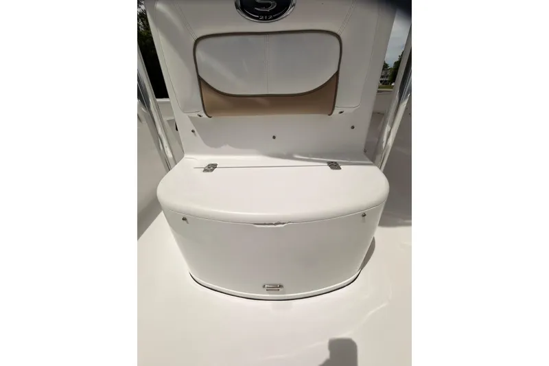 Slide: The Image of 2015 Sportsman Open 212 Center Console boat seat and storage compartment. - 18