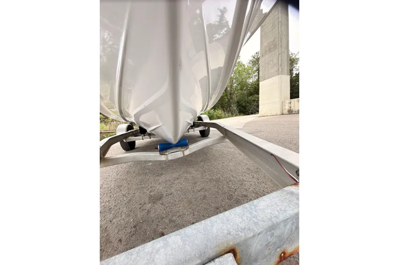 Slide: The Image of 2015 Sportsman Open 212 Center Console boat on trailer, viewed from below. - 23