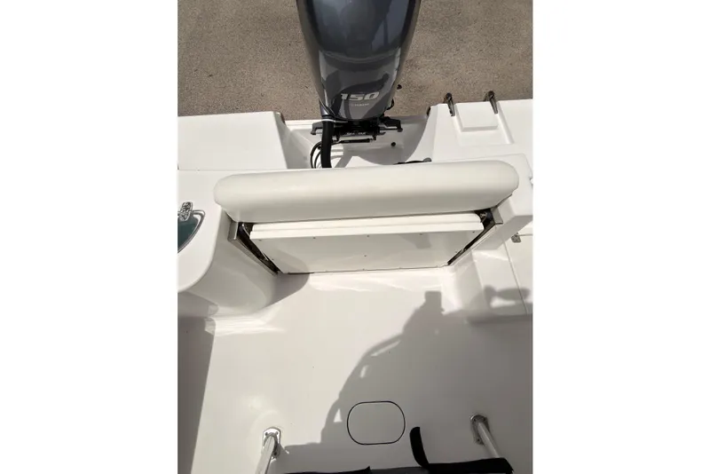 Slide: The Image of 2015 Sportsman Open 212 Center Console boat interior with engine and seating. - 25