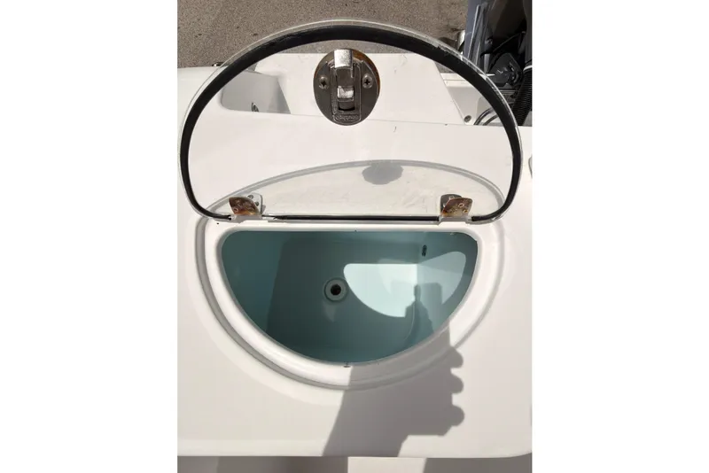 Slide: The Image of Open livewell on 2015 Sportsman Open 212 Center Console boat, showcasing interior. - 27