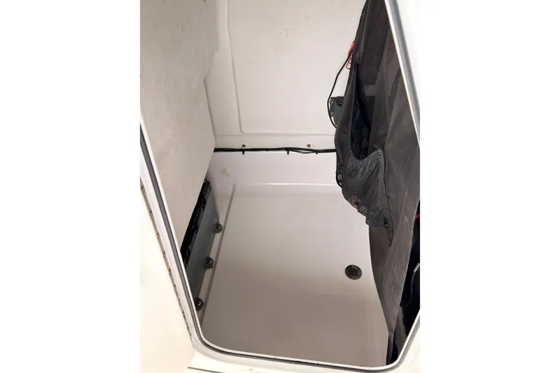 Slide: The Image of Interior view of a 2015 Sportsman Open 212 Center Console boat compartment. - 28