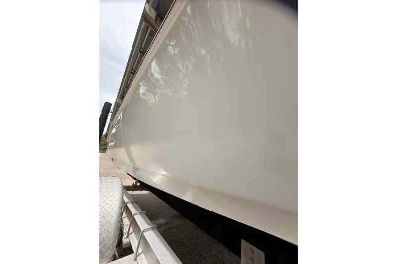 Slide: The Image of 2015 Sportsman Open 212 Center Console boat on trailer, side view. - 29
