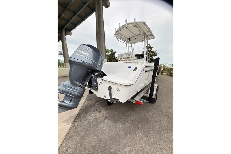 Slide: The Image of 2015 Sportsman Open 212 Center Console boat with Yamaha engine on trailer. - 3