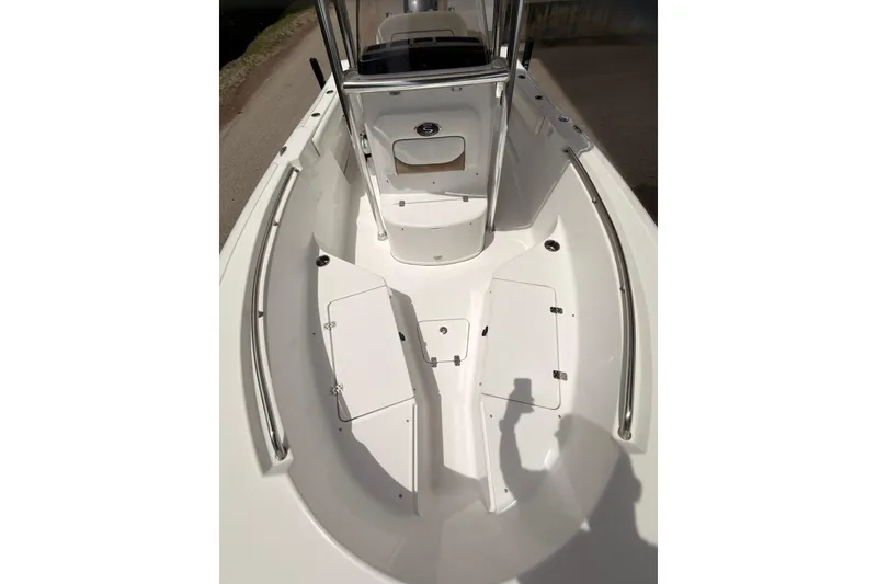 Slide: The Image of 2015 Sportsman Open 212 Center Console boat interior with storage compartments. - 8