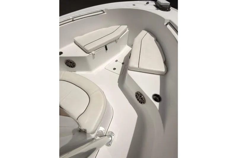 Slide: The Image of 2015 Sportsman Open 212 Center Console boat interior with cushioned seating and speakers. - 9