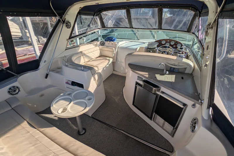 Slide: The Image of Interior of 2003 Rinker Fiesta Vee 342 boat with seating, kitchenette, and helm. - 12