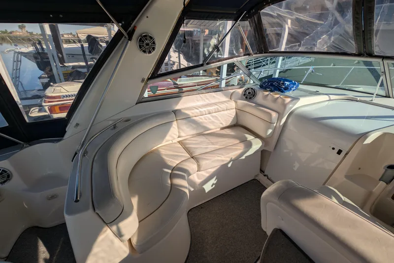 Slide: The Image of Interior of 2003 Rinker Fiesta Vee 342 boat with white leather seating and helm. - 22