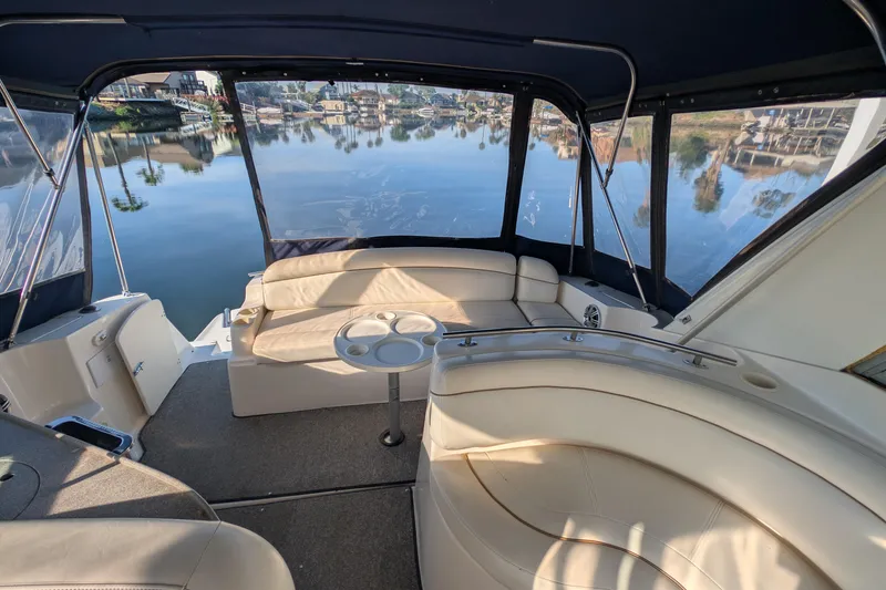 Slide: The Image of 2003 Rinker Fiesta Vee 342 boat interior with seating and water view. - 24