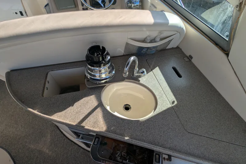 Slide: The Image of 2003 Rinker Fiesta Vee 342 boat interior with sink and countertop. - 28