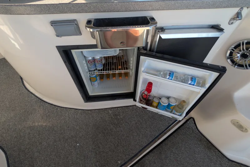 Slide: The Image of Mini fridge stocked with drinks on a 2003 Rinker Fiesta Vee 342 boat. - 30