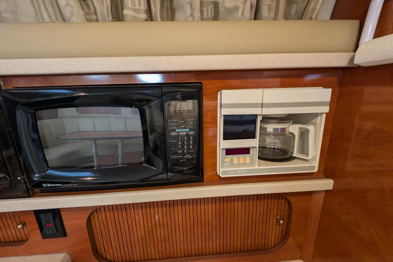 Slide: The Image of 2003 Rinker Fiesta Vee 342 galley with microwave and coffee maker. - 35