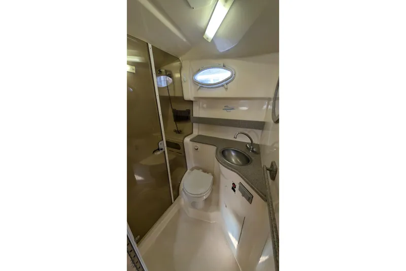 Slide: The Image of 2003 Rinker Fiesta Vee 342 bathroom with sink, toilet, and shower. - 43