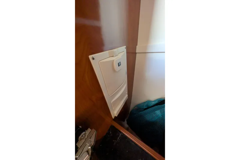 Slide: The Image of 2003 Rinker Fiesta Vee 342 cabin interior with wall-mounted central vac. - 48