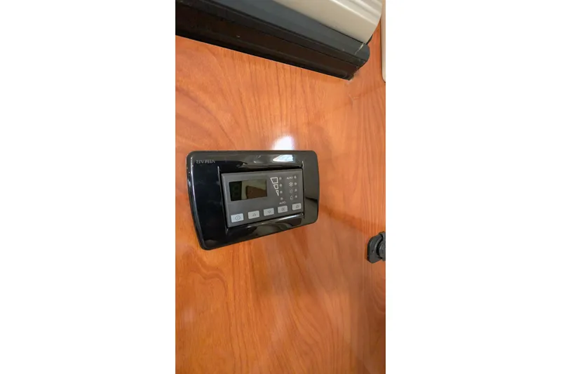 Slide: The Image of Control panel on 2003 Rinker Fiesta Vee 342 boat's wooden interior. - 53