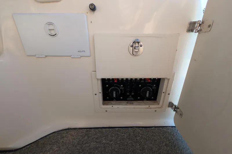 Slide: The Image of 2003 Rinker Fiesta Vee 342 electrical panel with open access door. - 59