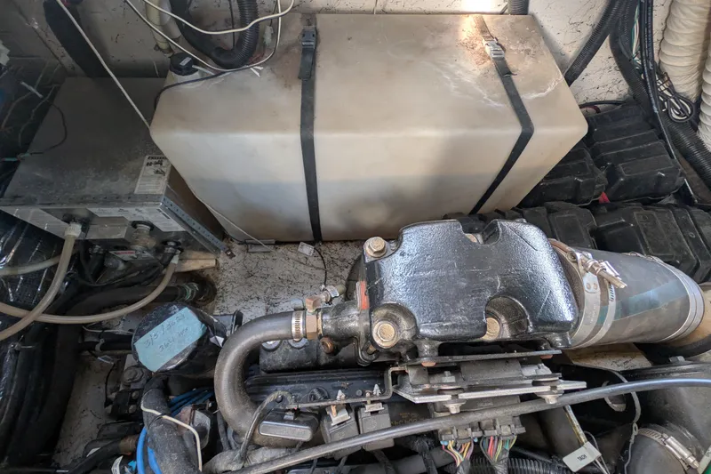 Slide: The Image of Engine compartment of a 2003 Rinker Fiesta Vee 342 boat, showing mechanical components. - 61