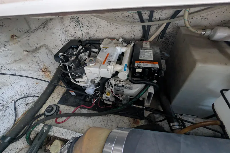 Slide: The Image of Engine compartment of a 2003 Rinker Fiesta Vee 342 with Kohler power system. - 63