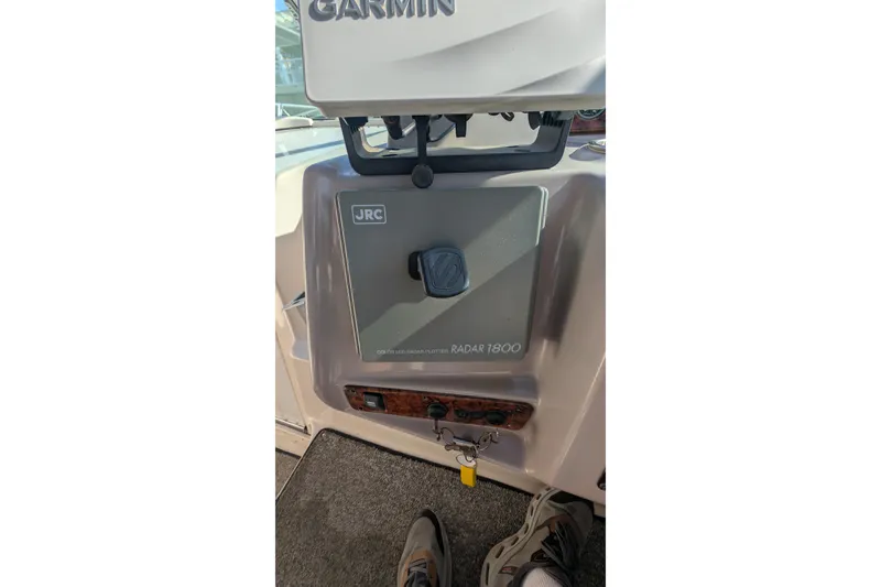 Slide: The Image of 2003 Rinker Fiesta Vee 342 cockpit with JRC Radar 1800 and Garmin equipment. - 65