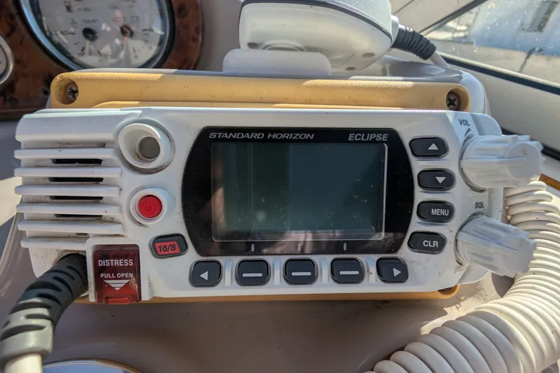 Slide: The Image of VHF marine radio on 2003 Rinker Fiesta Vee 342 boat dashboard. - 67