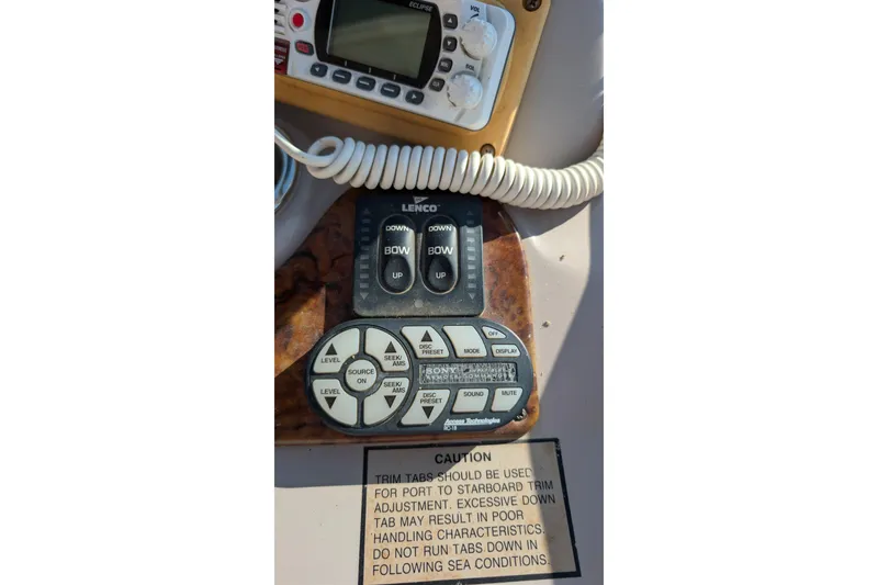 Slide: The Image of Control panel of a 2003 Rinker Fiesta Vee 342 boat with caution label. - 68