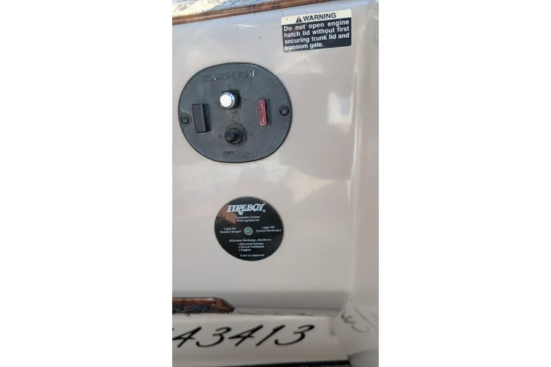 Slide: The Image of Control panel on a 2003 Rinker Fiesta Vee 342 boat with warning label. - 72