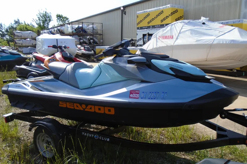 Slide: The Image of 2023 Sea-Doo GTI SE 130 jet ski on trailer, parked outdoors. - 4