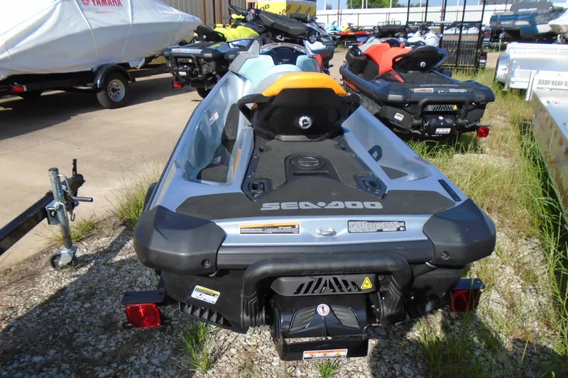 Slide: The Image of 2023 Sea-Doo GTI SE 130 jet ski parked outdoors, rear view. - 5